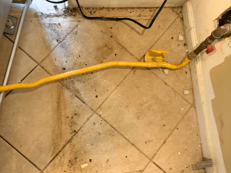 behind the oven cleaning