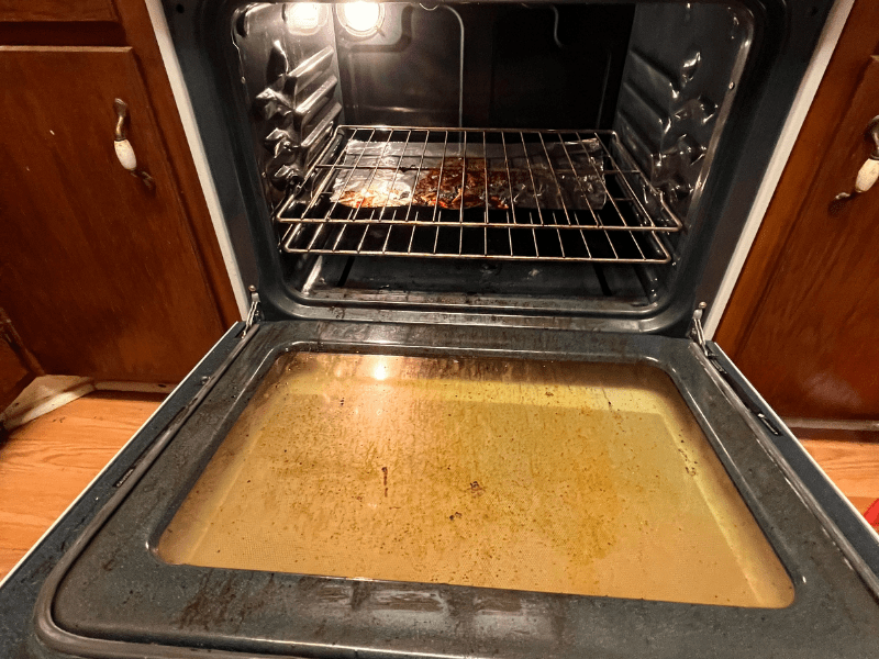 Before image of dirty oven before deep cleaning